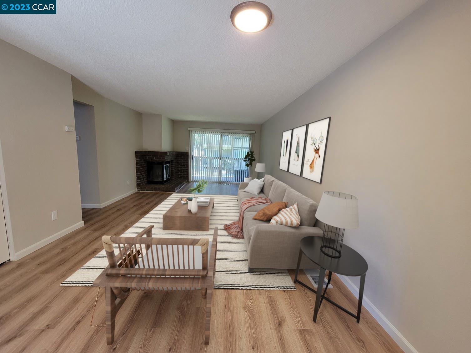 671 Chadwick Lane Bay Point, CA 94565 - Photo 1 of 1 a living room with furniture and a fireplace