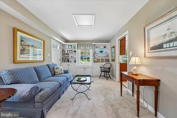 a spacious bedroom with a bed and a couch