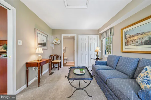 a bedroom with a bed and ceiling fan