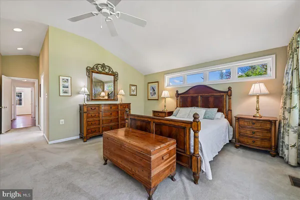 a view of a room with wooden floor and bathroom