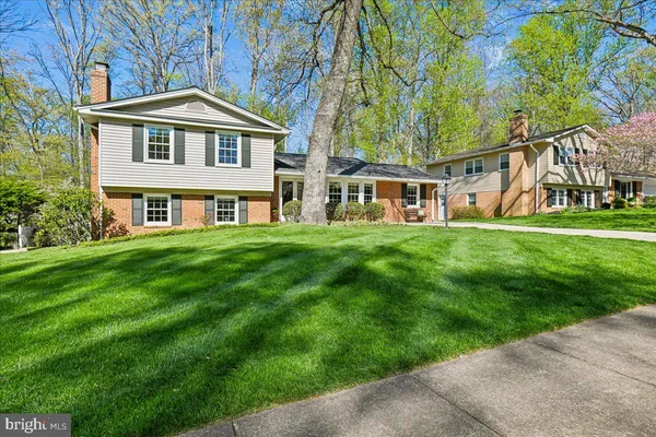 a front view of a building with a garden