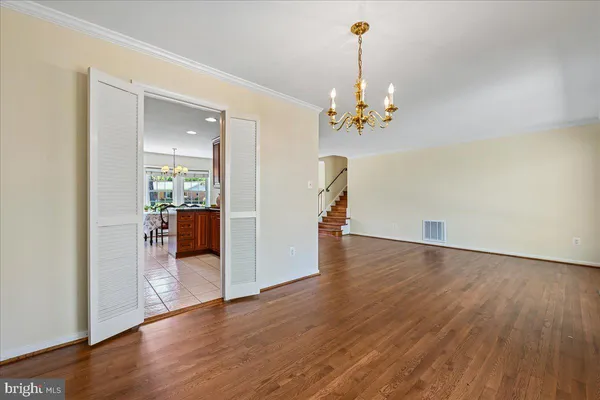 a kitchen with stainless steel appliances granite countertop a stove and a refrigerator