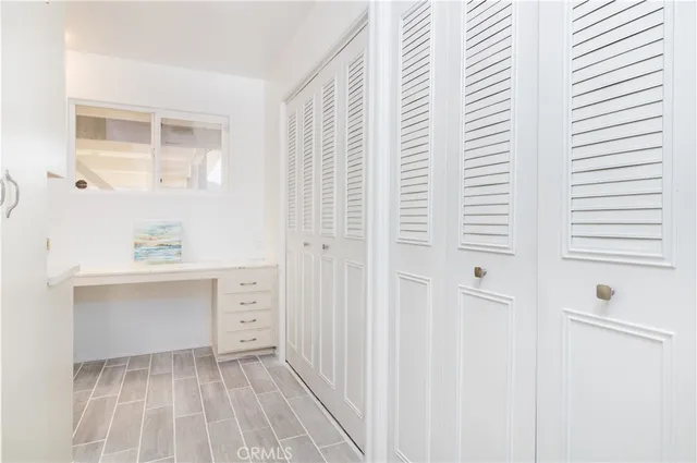 a bathroom with a shower sink vanity and mirror