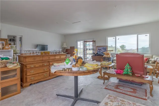 a bathroom with a sink toilet and window