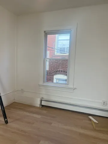 a view of a window and an empty room