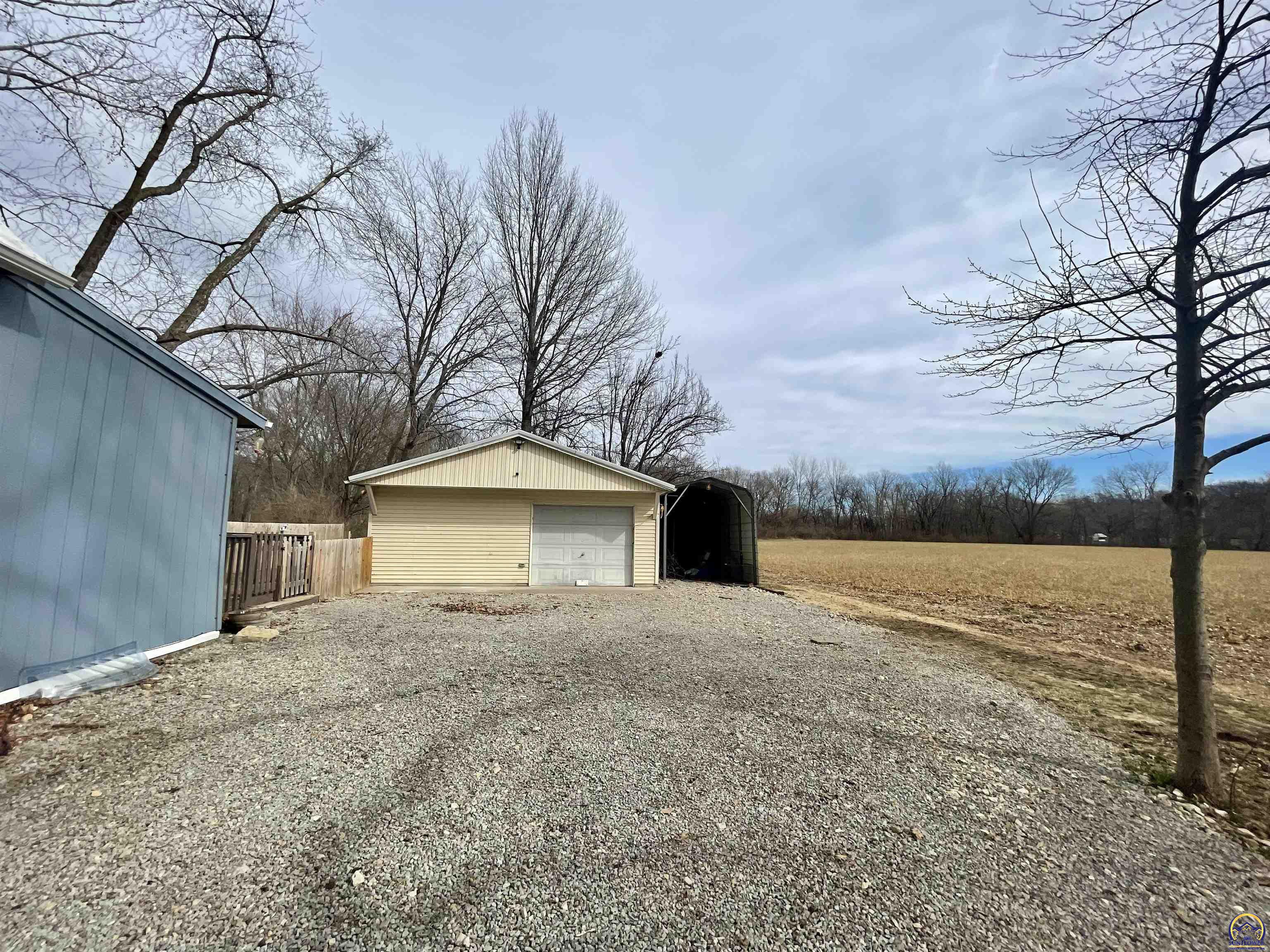 10134 Southwest Jordan Road Wakarusa, KS 66546 - Photo 29 of 36 View of Garage and Carport