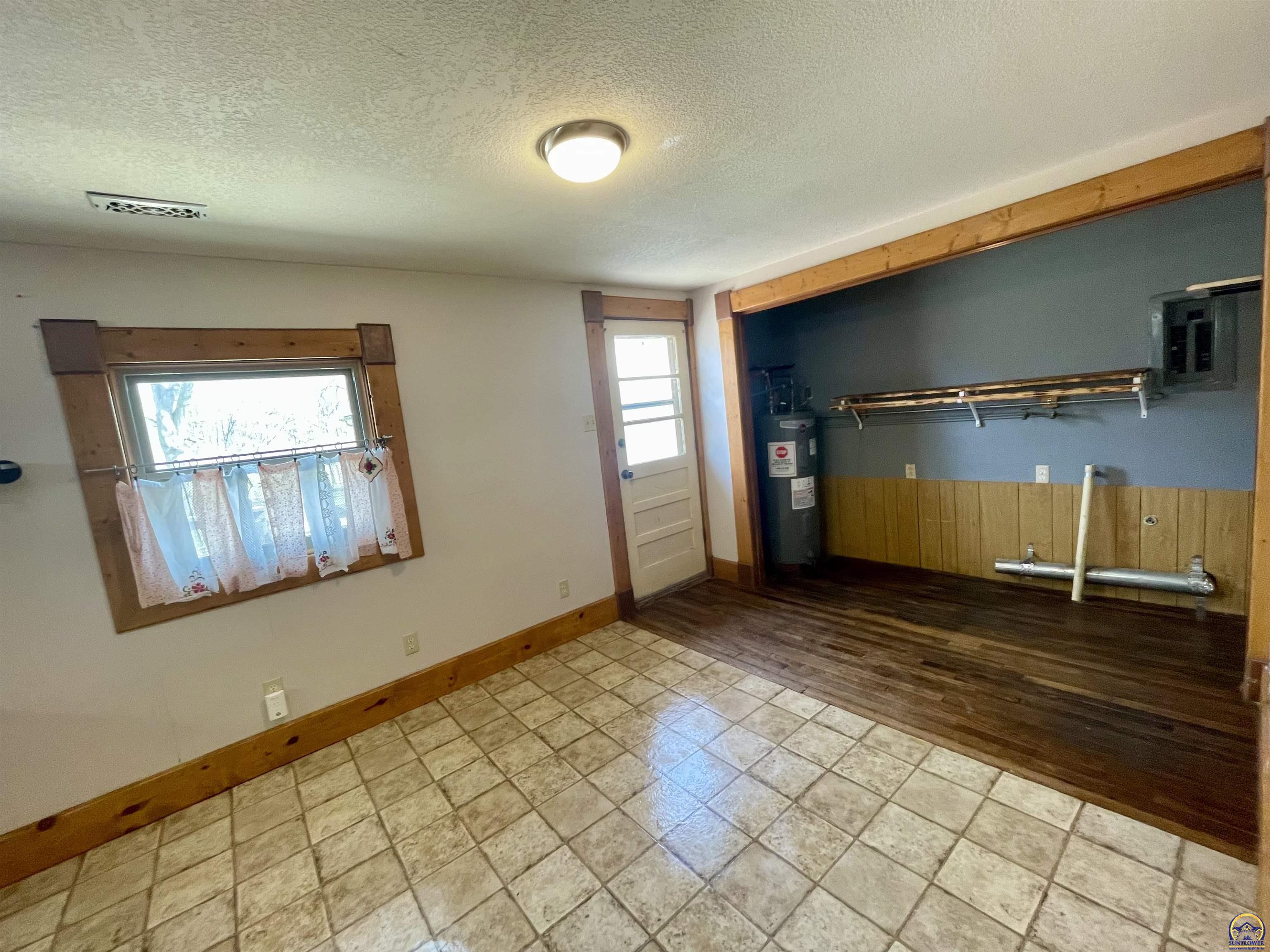 10134 Southwest Jordan Road Wakarusa, KS 66546 - Photo 7 of 36 Laundry Closet in Kitchen