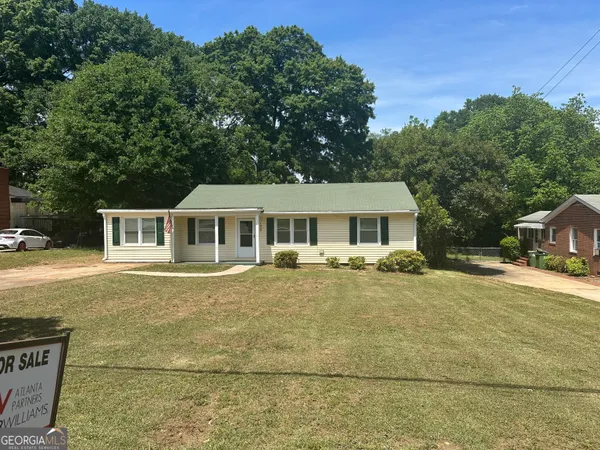 a front view of a house with a garden and porch