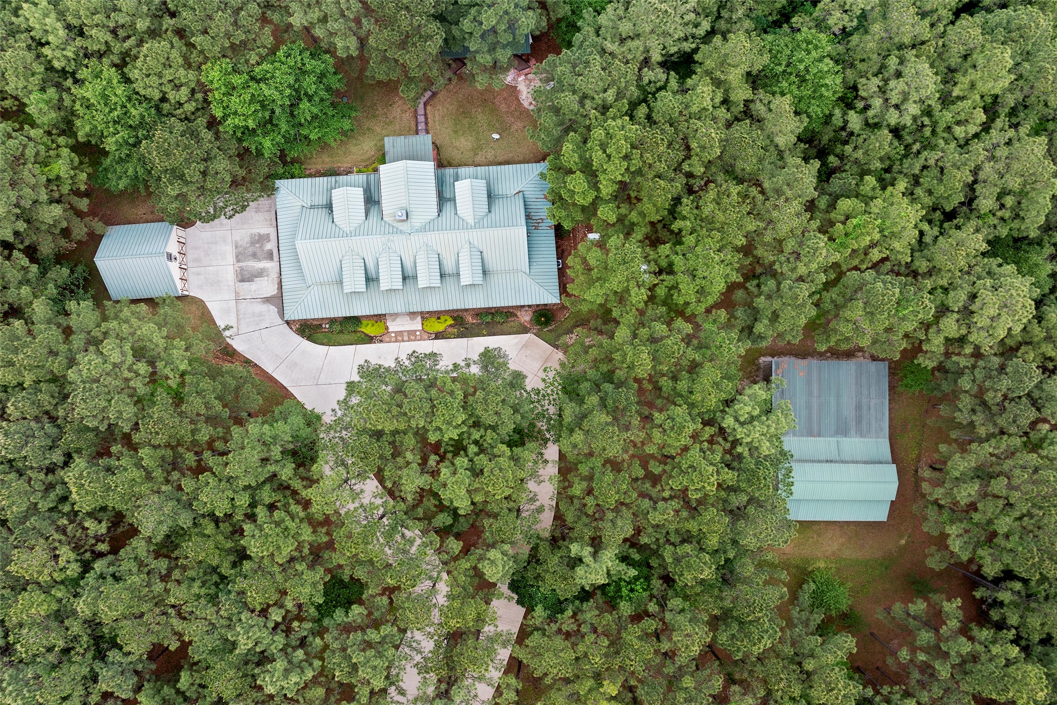 Welcome home to 519 Dodge Oakhurst- nestled amongst the trees in Huntsville, Texas!