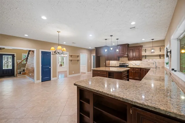 a dining room with furniture a rug and wooden floor