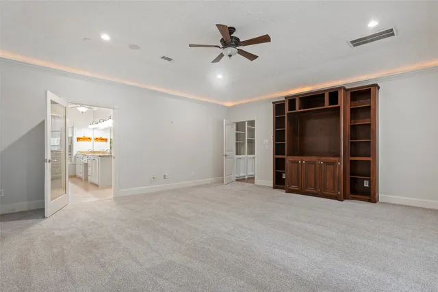 a kitchen with stainless steel appliances granite countertop a sink and a refrigerator