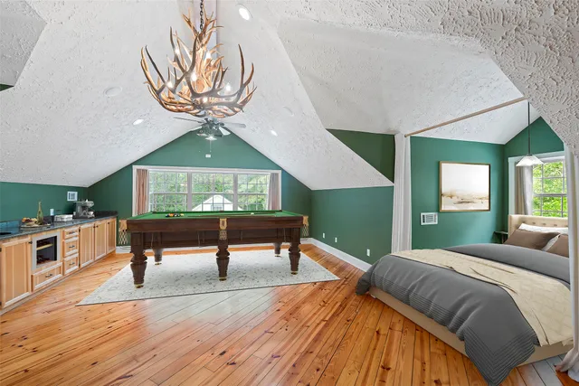 a bathroom with a granite countertop sink a toilet and mirror