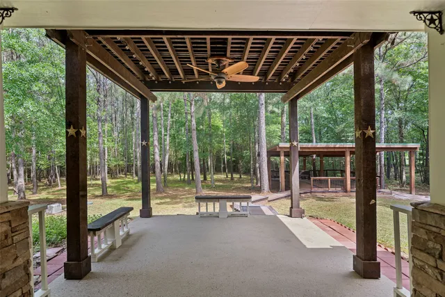 a view of a swimming pool with a patio
