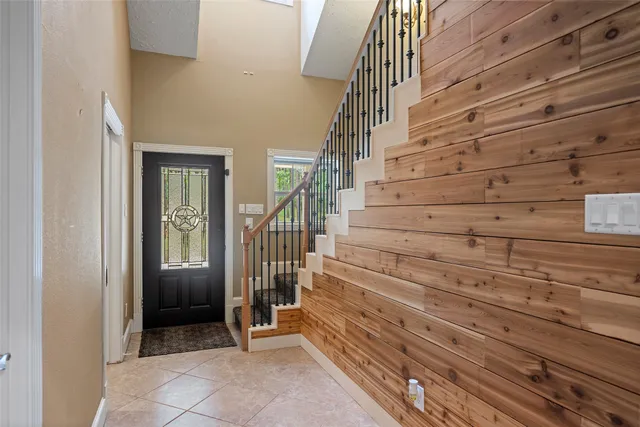 a kitchen with a sink dishwasher and white cabinets