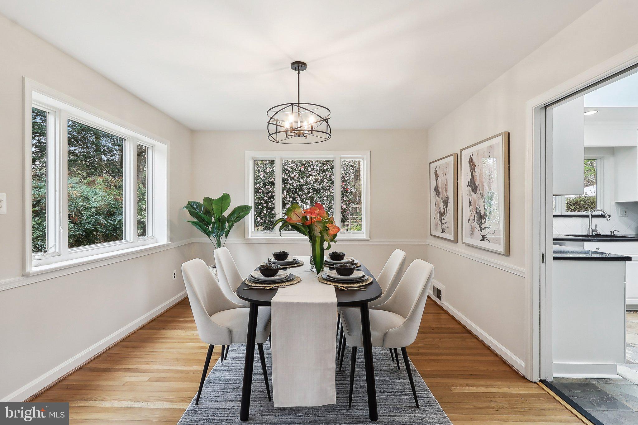 4212 Wakefield Drive Annandale, VA 22003 - Photo 11 of 67 a dining room with furniture a chandelier and wooden floor