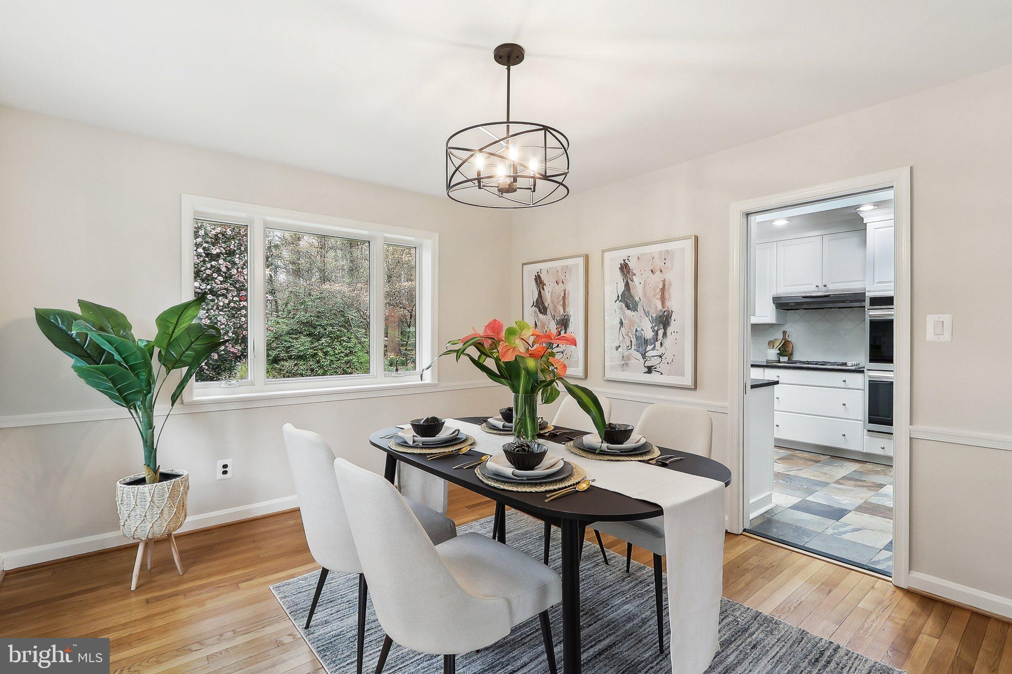 4212 Wakefield Drive Annandale, VA 22003 - Photo 14 of 67 a dining room with furniture potted plants and wooden floor