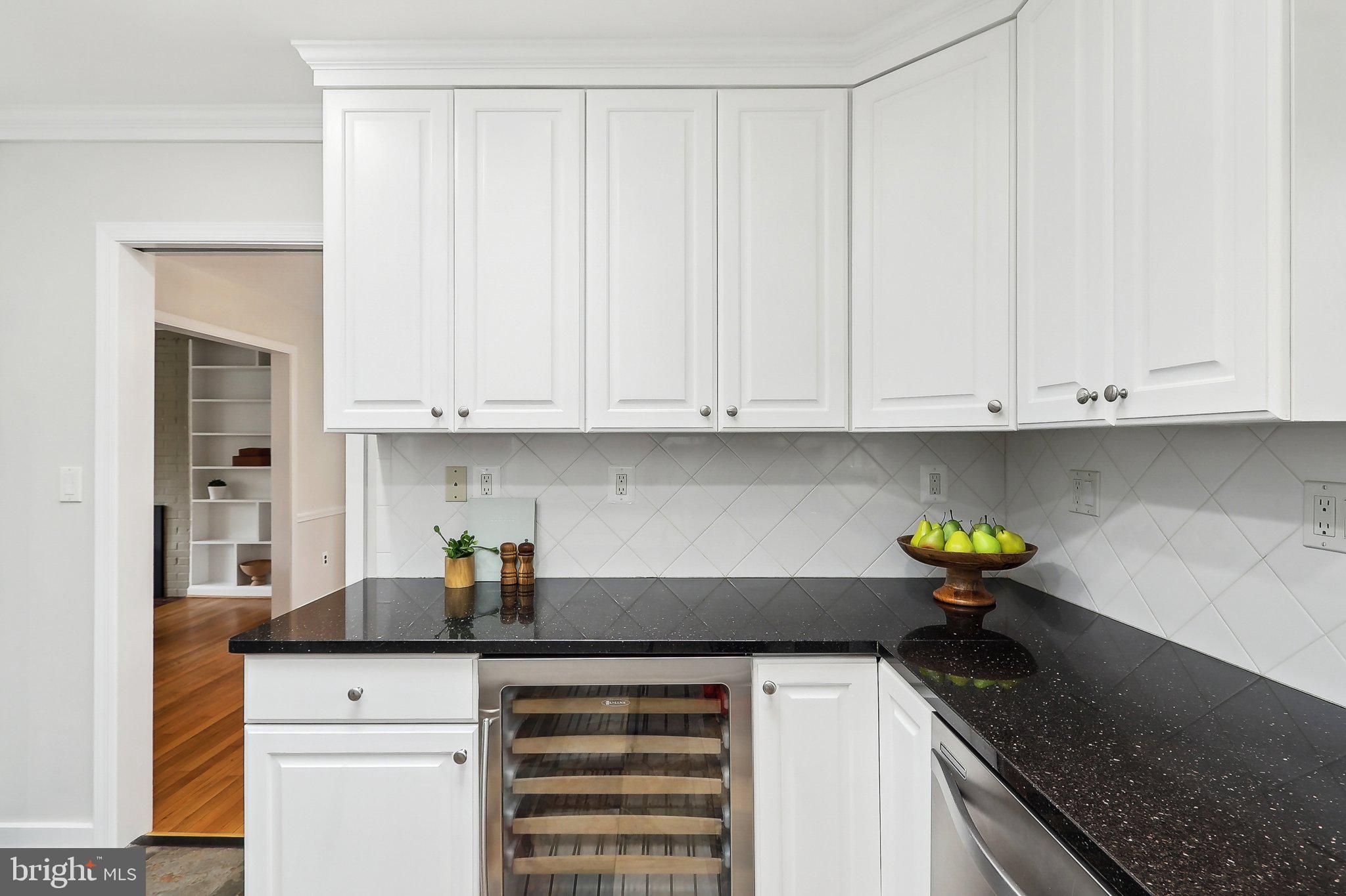 4212 Wakefield Drive Annandale, VA 22003 - Photo 18 of 67 a kitchen with stainless steel appliances granite countertop a sink a stove and dishwasher with white cabinets