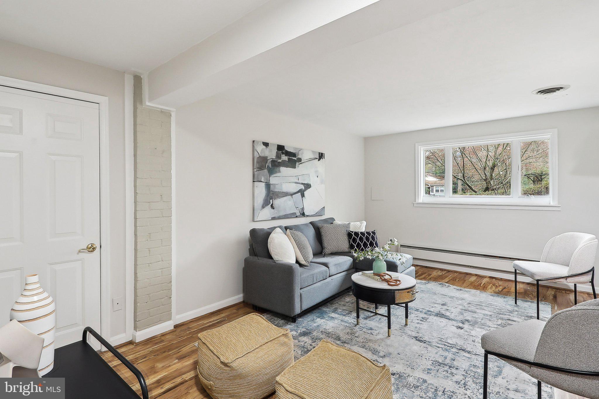 4212 Wakefield Drive Annandale, VA 22003 - Photo 21 of 67 a living room with furniture a rug and a window