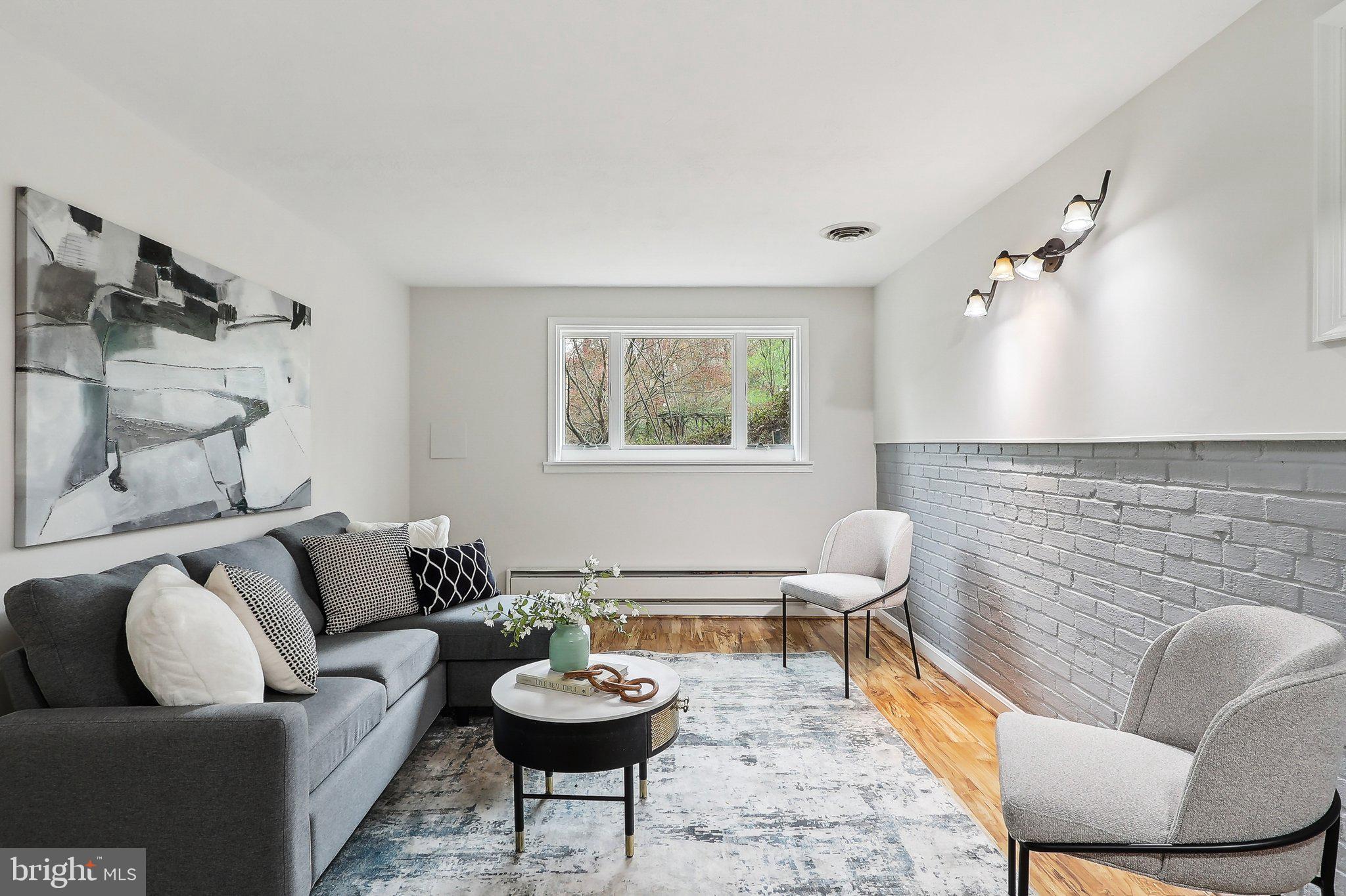 4212 Wakefield Drive Annandale, VA 22003 - Photo 22 of 67 a living room with furniture and a rug