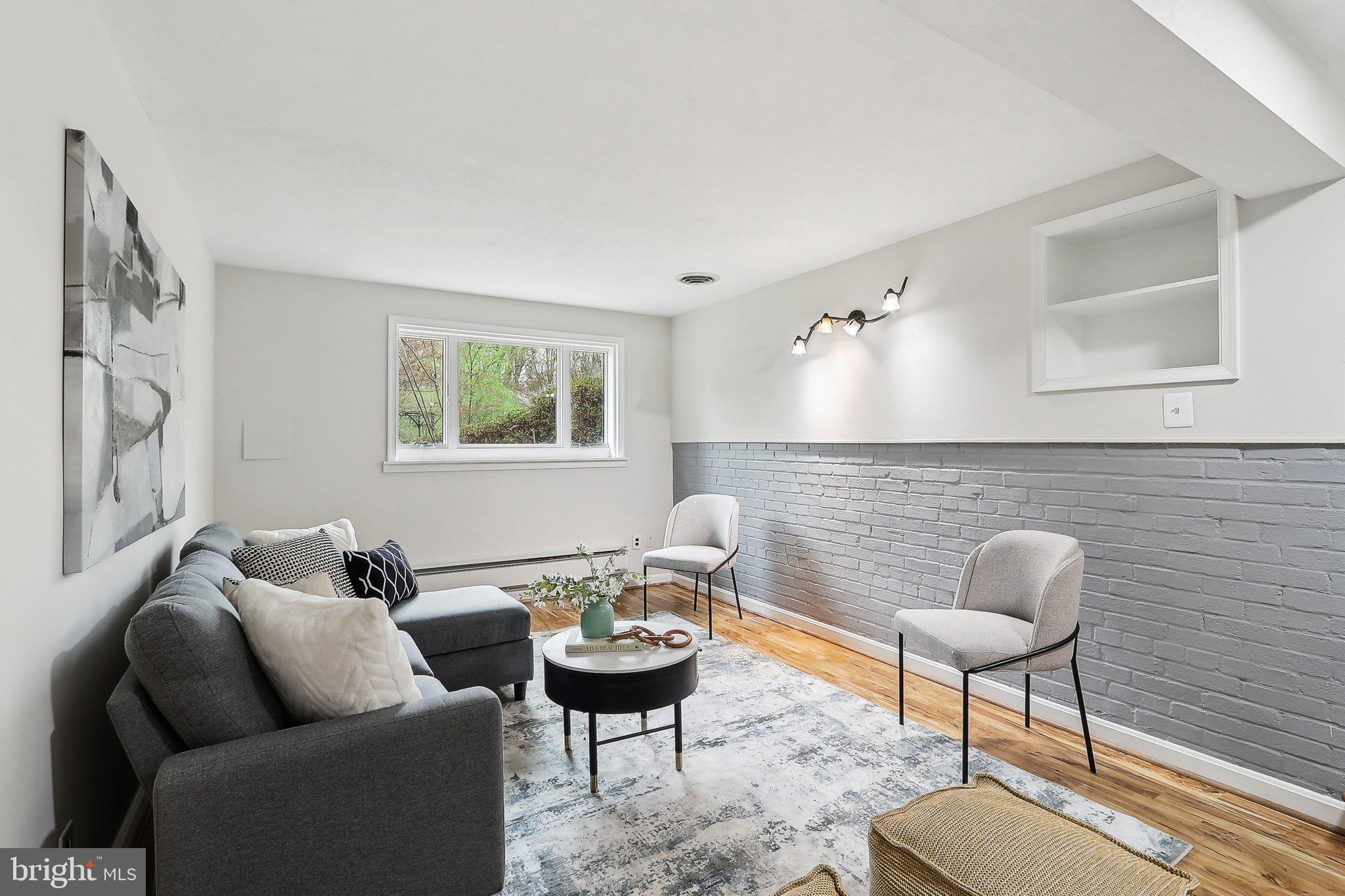 4212 Wakefield Drive Annandale, VA 22003 - Photo 23 of 67 a living room with furniture and a potted plant
