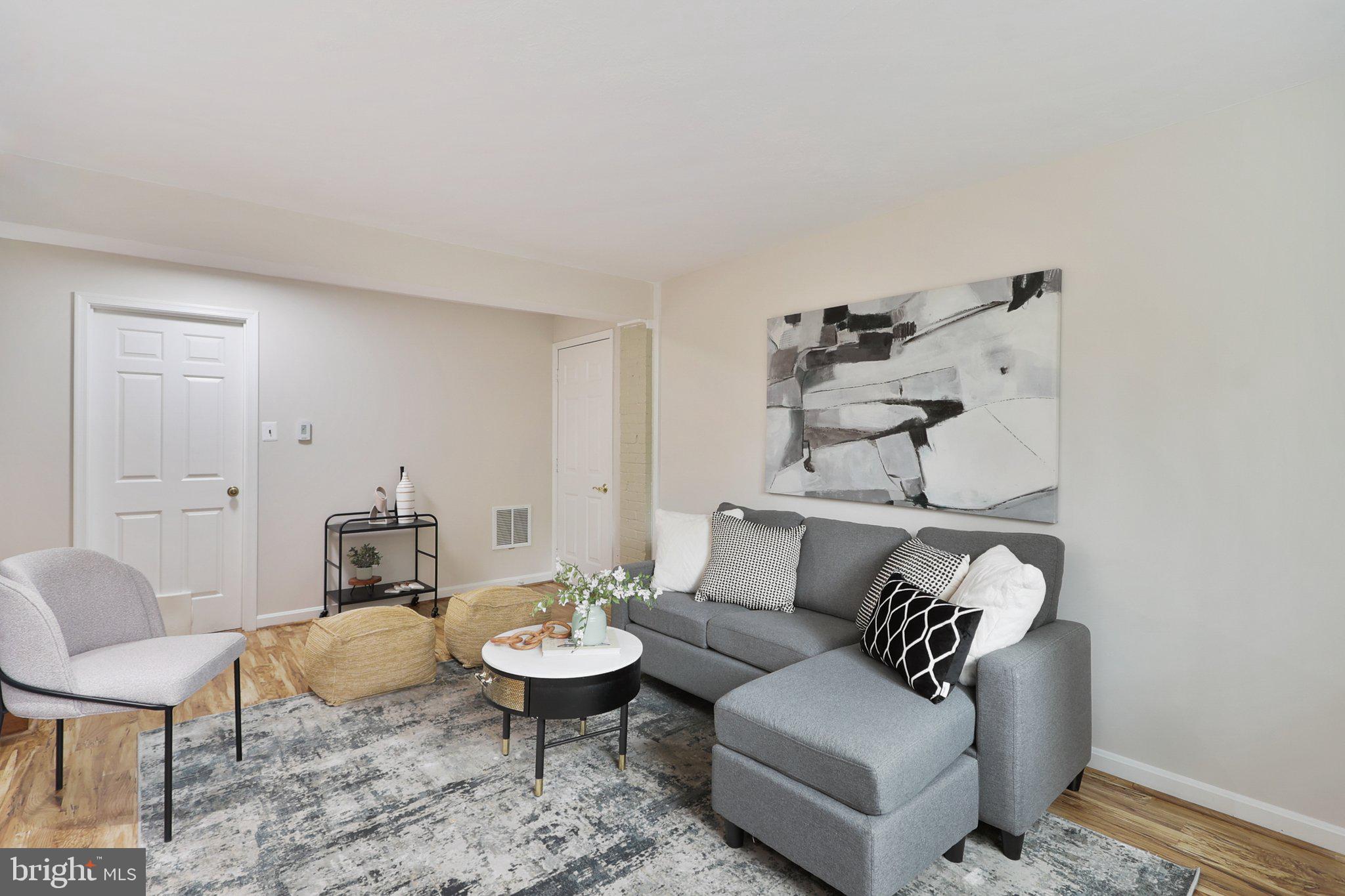 4212 Wakefield Drive Annandale, VA 22003 - Photo 25 of 67 a living room with furniture and a table
