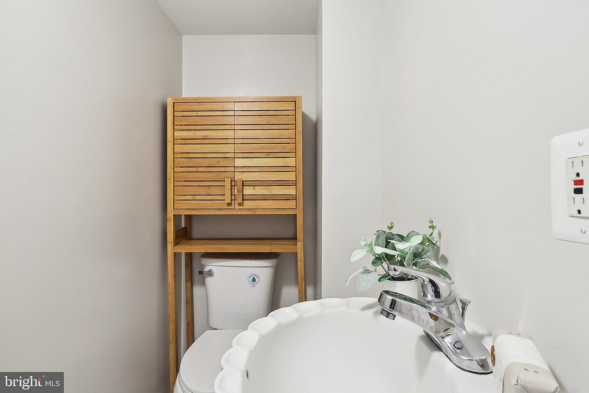 4212 Wakefield Drive Annandale, VA 22003 - Photo 28 of 67 a bathroom with a sink a vanity and a mirror