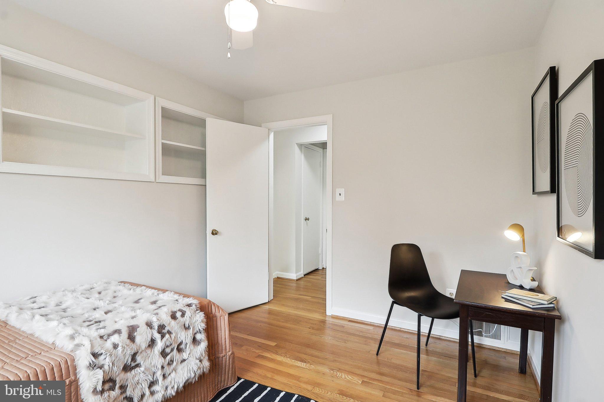 4212 Wakefield Drive Annandale, VA 22003 - Photo 31 of 67 a bedroom with a bed and a table in it