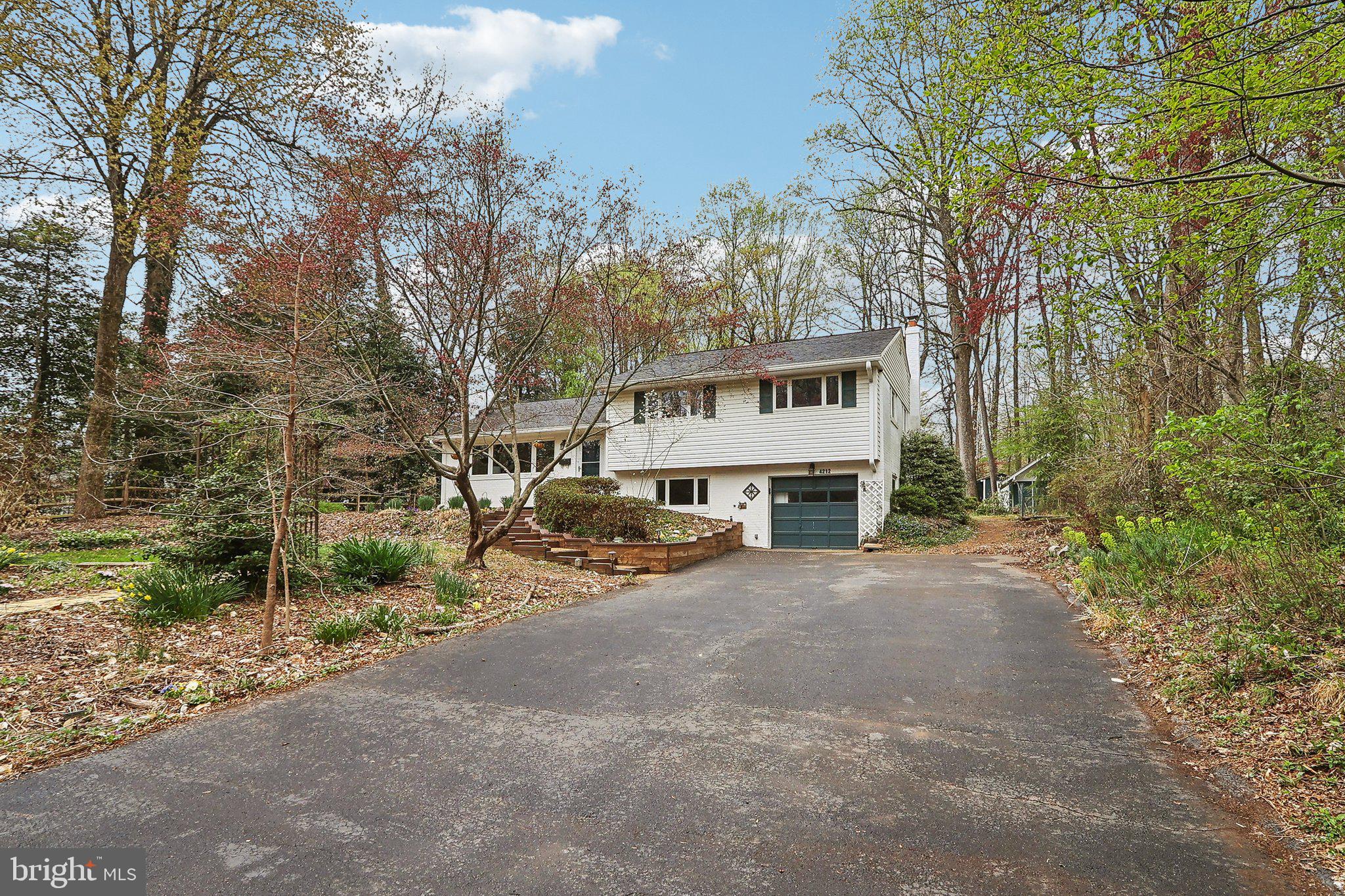 4212 Wakefield Drive Annandale, VA 22003 - Photo 4 of 67 a view of a house with large trees and a big yard