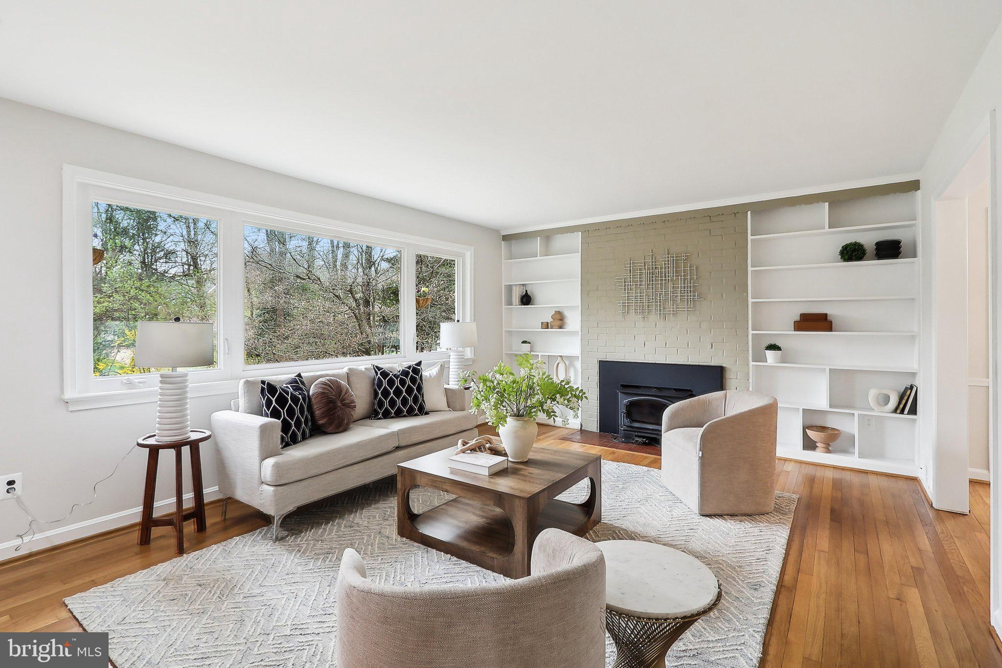 4212 Wakefield Drive Annandale, VA 22003 - Photo 6 of 67 a living room with fireplace furniture and a large window