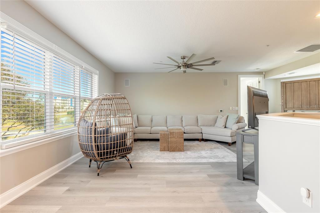 4641 Riverwalk Village Court Ponce Inlet, FL 32127 - Photo 24 of 74 a living room with furniture and a large window