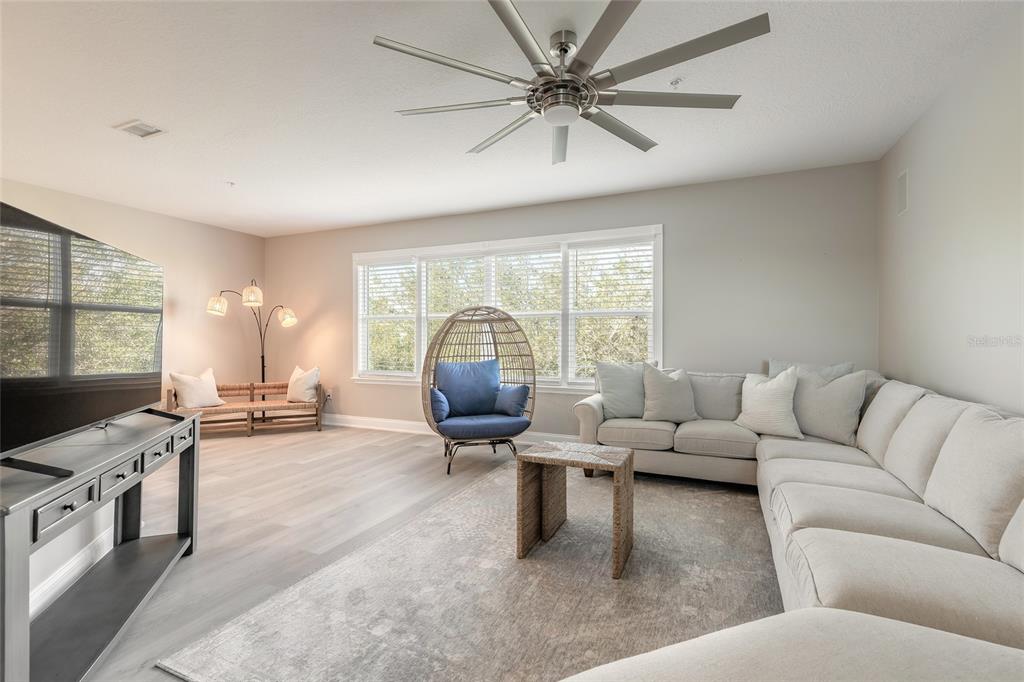 4641 Riverwalk Village Court Ponce Inlet, FL 32127 - Photo 27 of 74 a living room with furniture and a flat screen tv