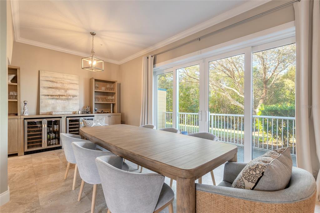 4641 Riverwalk Village Court Ponce Inlet, FL 32127 - Photo 46 of 74 a view of a dining room with furniture window and outside view