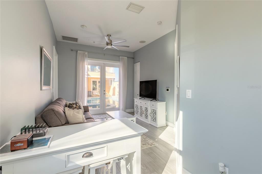 4641 Riverwalk Village Court Ponce Inlet, FL 32127 - Photo 59 of 74 a living room with furniture a flat screen tv and a window