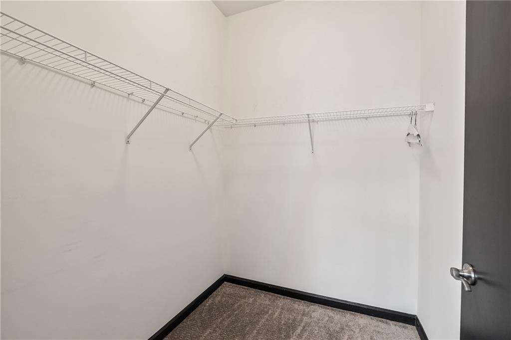 5300 Peachtree Road, Unit 2605 Chamblee, GA 30341 - Photo 13 of 26 a view of a room with racks on the wall