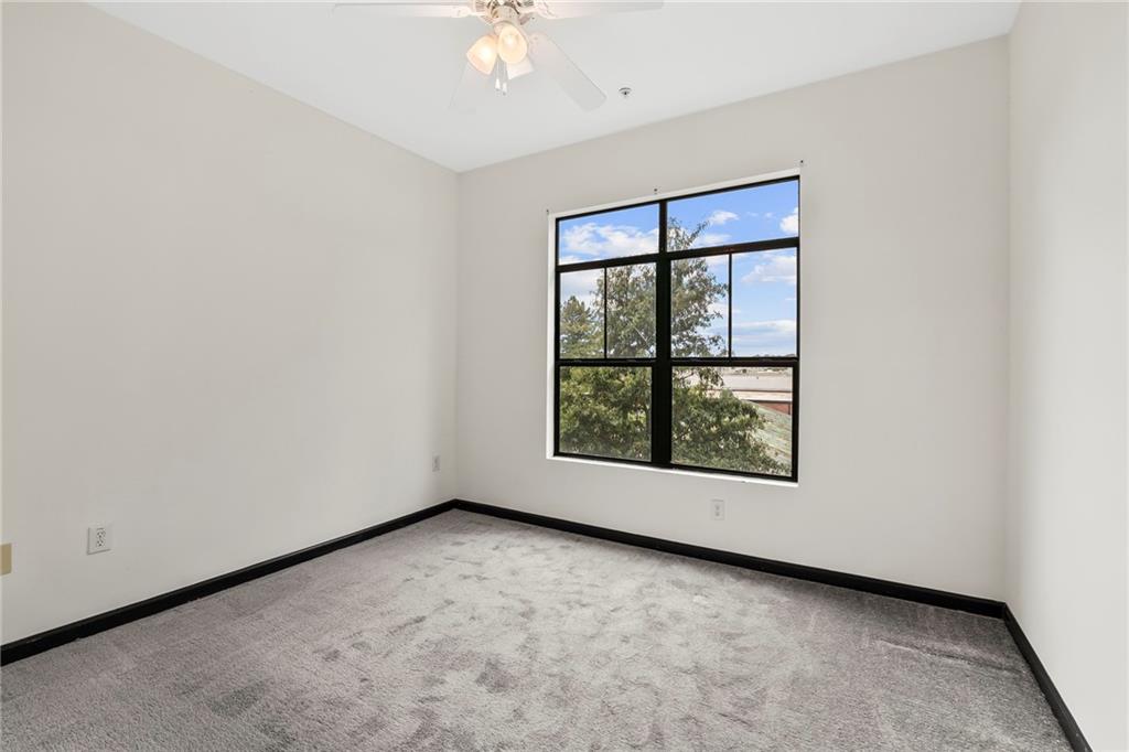 5300 Peachtree Road, Unit 2605 Chamblee, GA 30341 - Photo 15 of 26 an empty room with windows