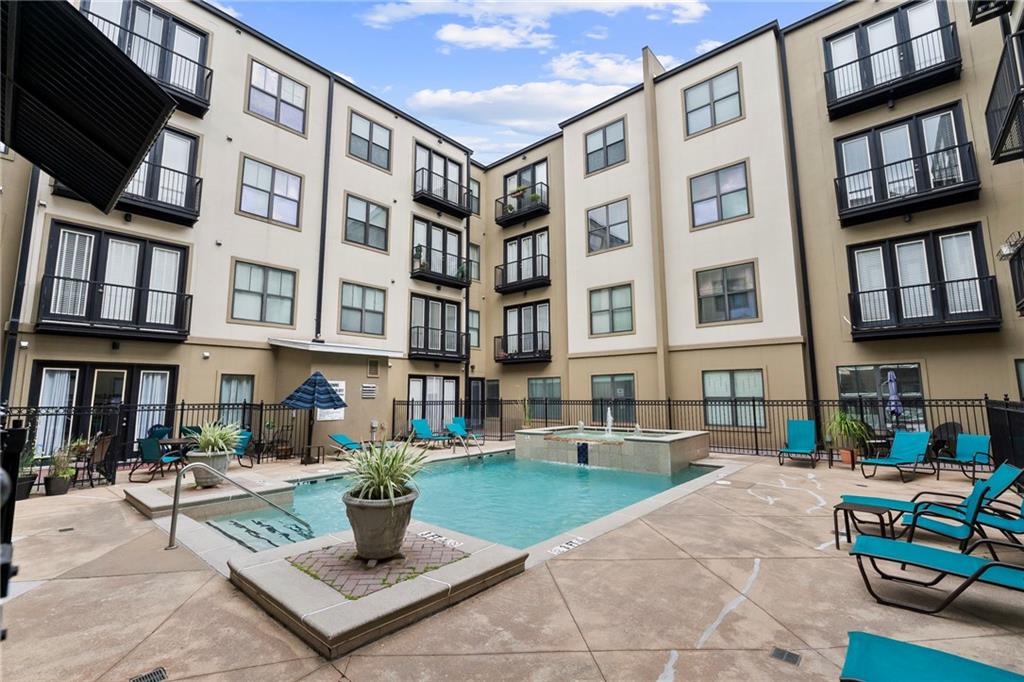 5300 Peachtree Road, Unit 2605 Chamblee, GA 30341 - Photo 19 of 26 a patio with a table and chairs potted plants