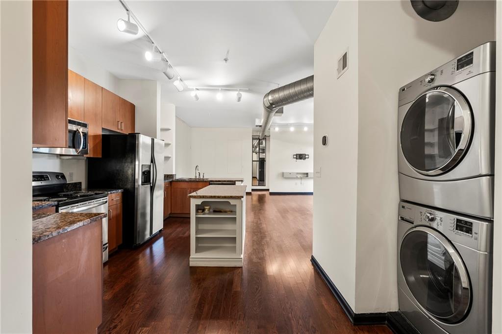 5300 Peachtree Road, Unit 2605 Chamblee, GA 30341 - Photo 2 of 26 a view of a kitchen with a stove top oven a refrigerator and cabinets