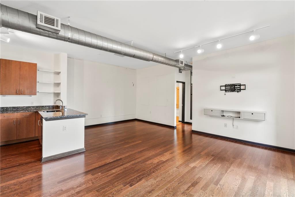 5300 Peachtree Road, Unit 2605 Chamblee, GA 30341 - Photo 9 of 26 a view of an empty room with wooden floor