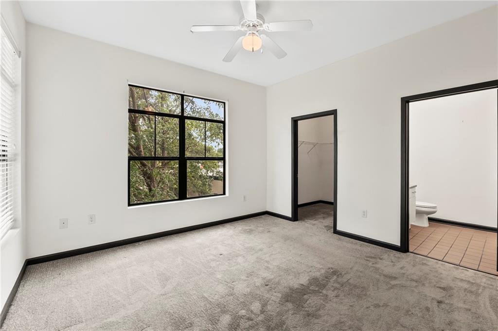 5300 Peachtree Road, Unit 2605 Chamblee, GA 30341 - Photo 10 of 26 an empty room with windows and closet