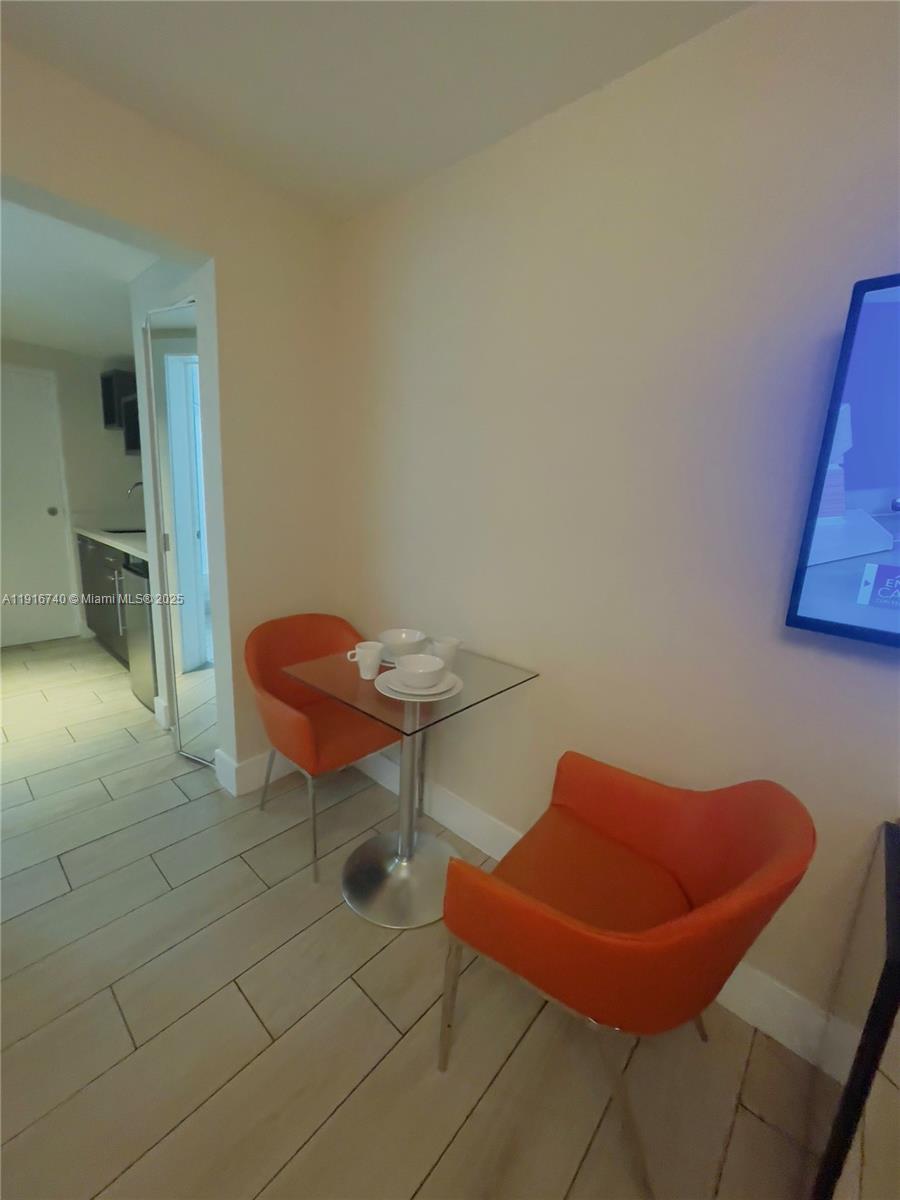 7310 Harding Avenue, Unit 309 Miami Beach, FL 33141 - Photo 5 of 8 a outdoor space with sitting area