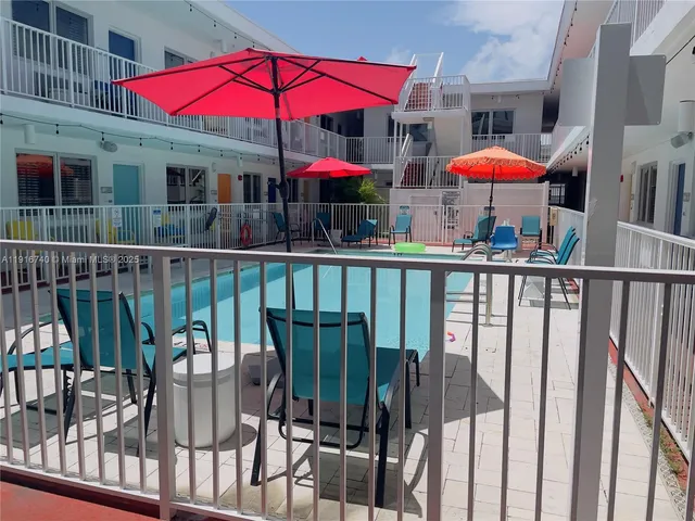 a view of a balcony with furniture and wooden deck