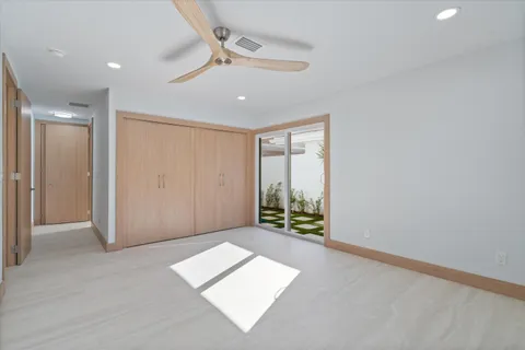 a view of balcony with wooden floor and outdoor seating