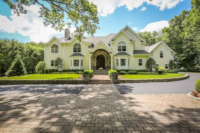 70 Hartcroft Road Stamford, CT 06903 - Photo 1 of 1 a view of a house with a big yard and large trees