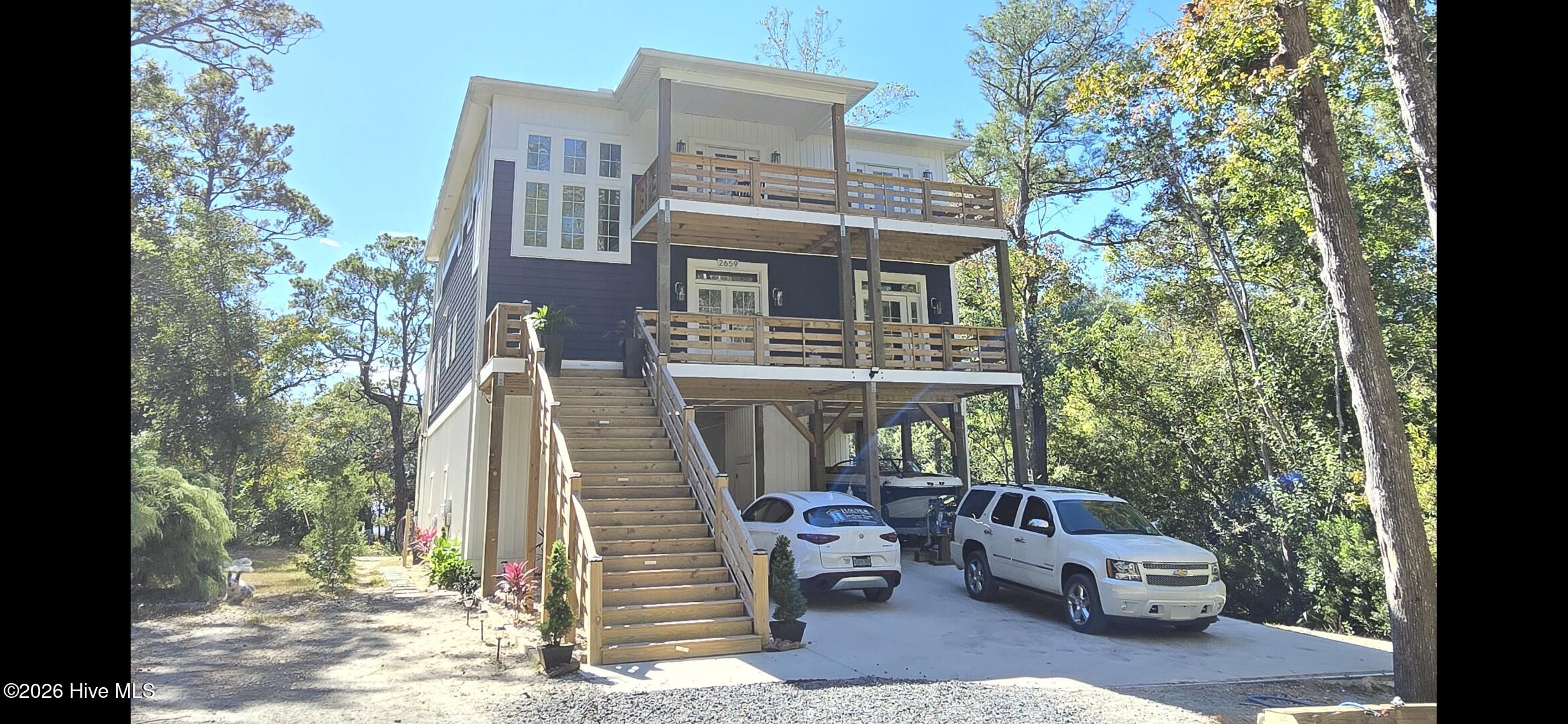 2659 Seashore Road Southwest Supply, NC 28462 - Photo 2 of 75 DREAM BEACH HOME WITH OVER 2.43 ACRES ON THE INTRACOASTAL WATERWAY ! THE PERFECT BLEND OF FOREST AND BEACH AND NO HOA …A HIDDEN GEM! HIGH ELEVATION