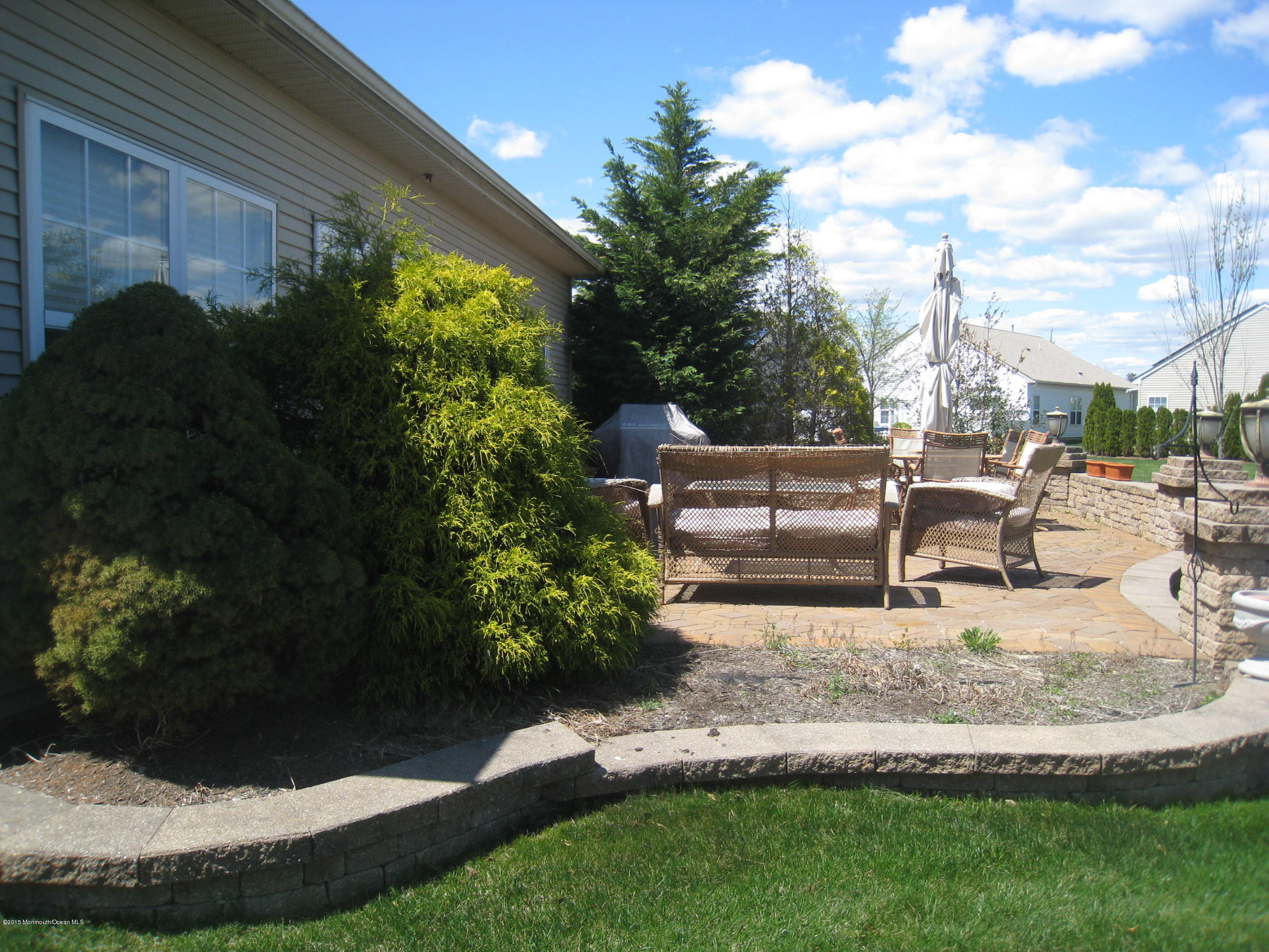 4 Ravello Road Manchester Township, NJ 08759 - Photo 22 of 27 a view of a chair and table in backyard of the house