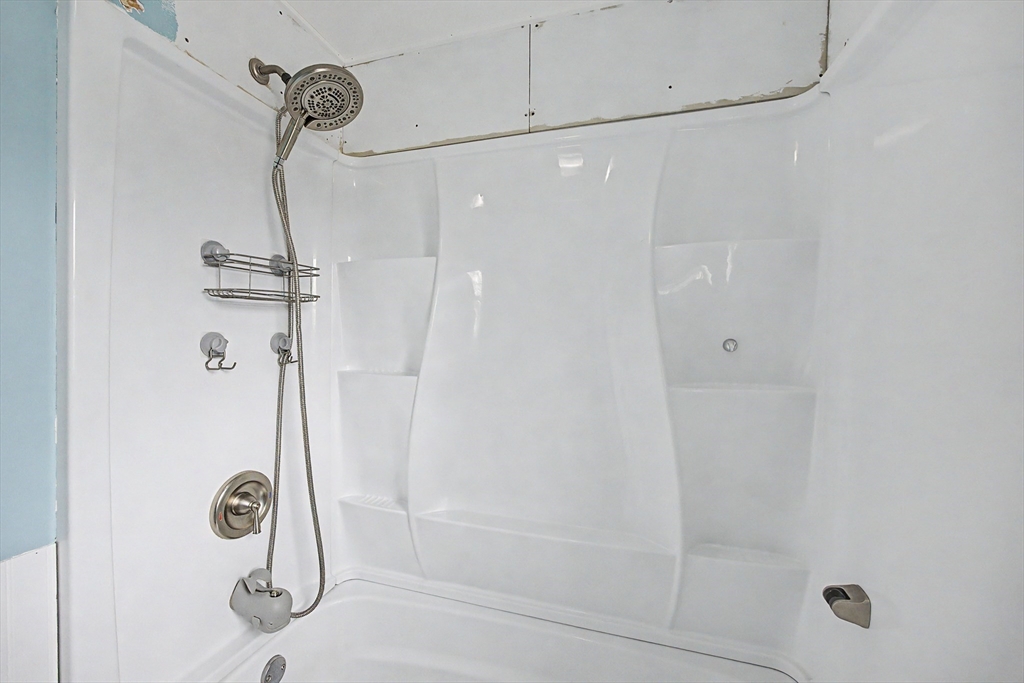 19 R Brian Avenue Derry, NH 03038 - Photo 31 of 37 a bathroom with a shower