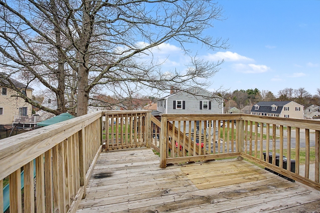 19 R Brian Avenue Derry, NH 03038 - Photo 34 of 37 a view of balcony with wooden floor and fence