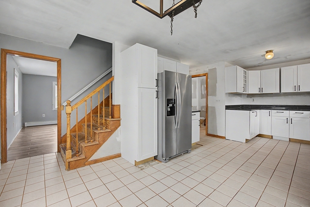 19 R Brian Avenue Derry, NH 03038 - Photo 8 of 37 a view of kitchen with stainless steel appliances granite countertop a refrigerator and a stove top oven