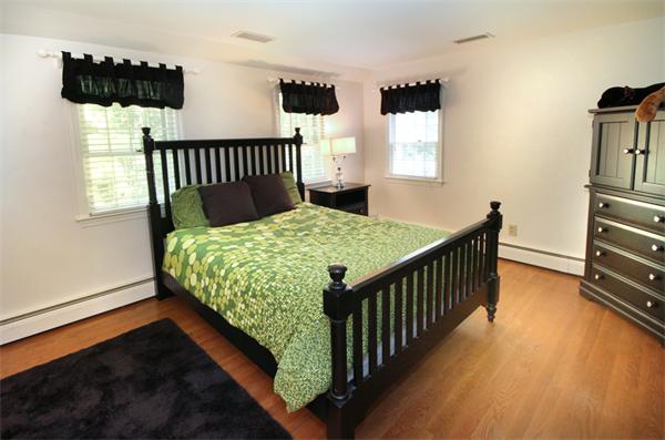 50 Towne Road Boxford, MA 01921 - Photo 15 of 30 a bed sitting in a bedroom next to a window