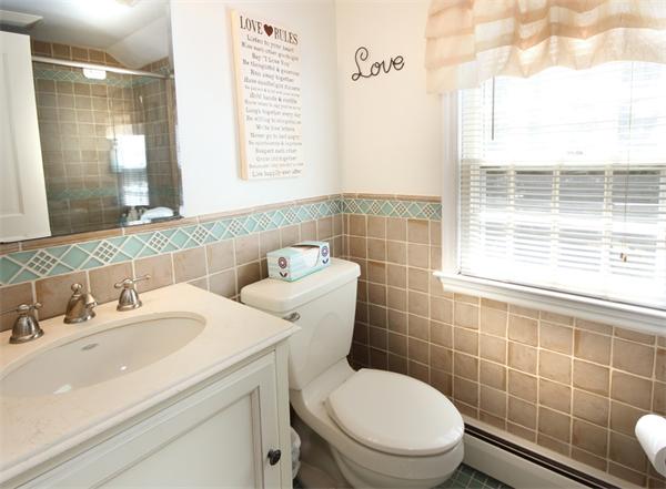 50 Towne Road Boxford, MA 01921 - Photo 18 of 30 a bathroom with a sink a toilet and a mirror